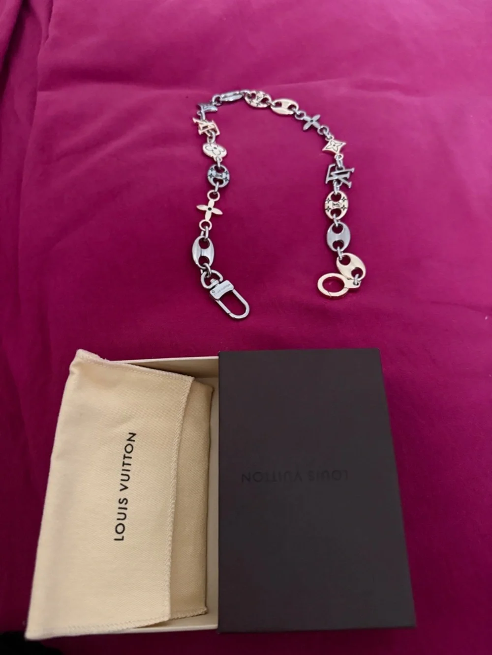 Louis Vuitton Silver Logo Charm Chain Belt on Pink Background - Picture 2 of 6